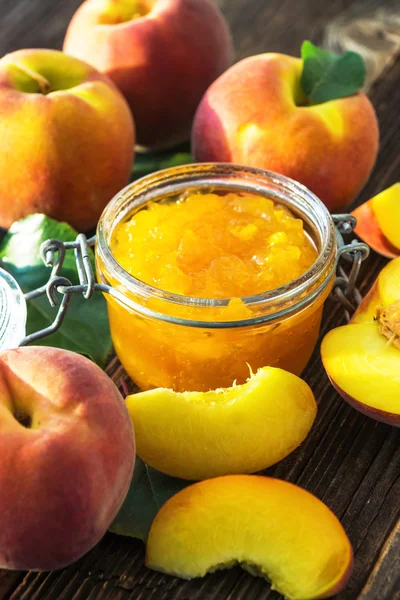 Peach jam and fresh peaches