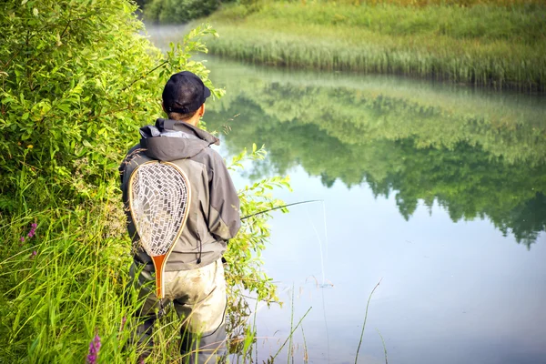 Fisherman fly fishing — Stock Photo, Image