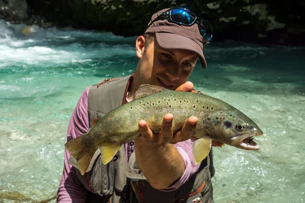 Pescador e peixe grande — Fotografia de Stock