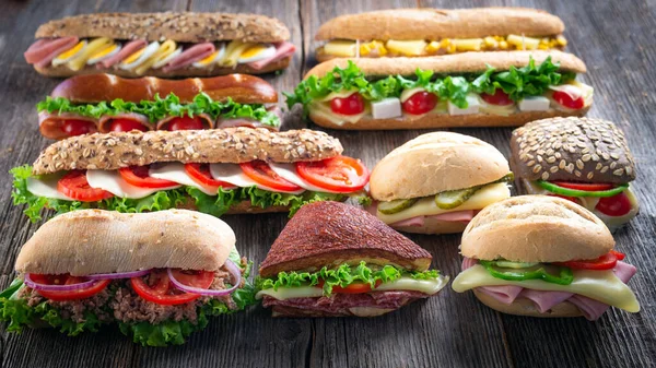 Assorted Sandwiches Wooden Background — Stock Photo, Image