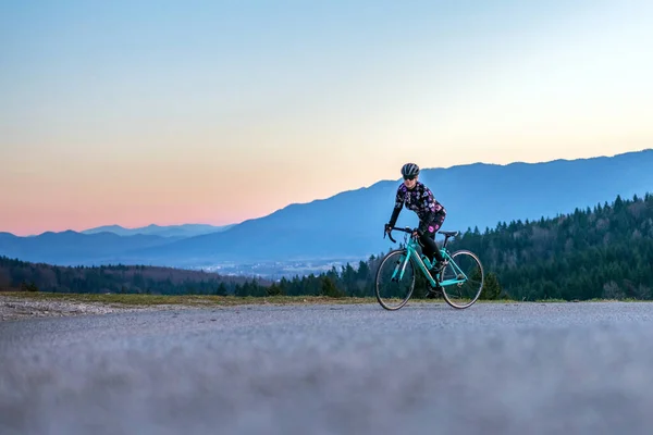 Young Woman Cycling Mountain Road Daytime Stock Picture