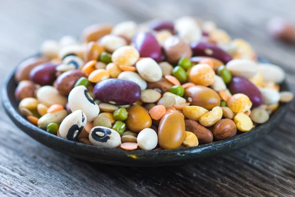 Legumes close up in plate — Stock Photo, Image