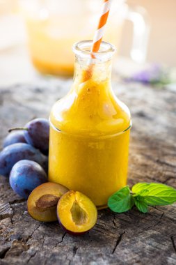 Bottle with plum smoothie