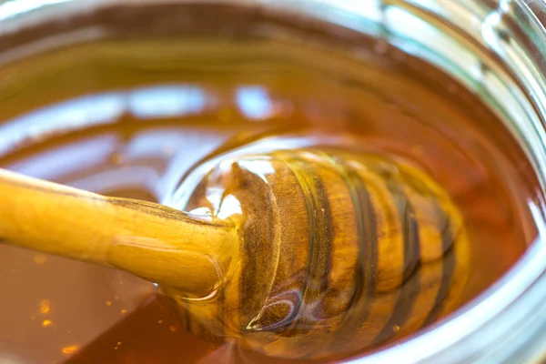 Glass jar of honey — Stock Photo, Image