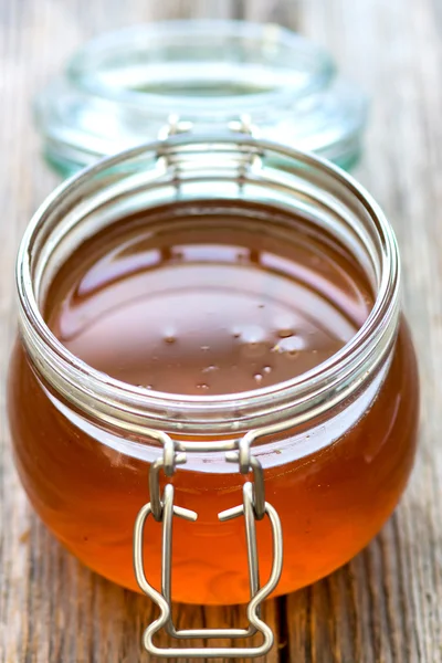 Glass jar with honey — Stock Photo, Image