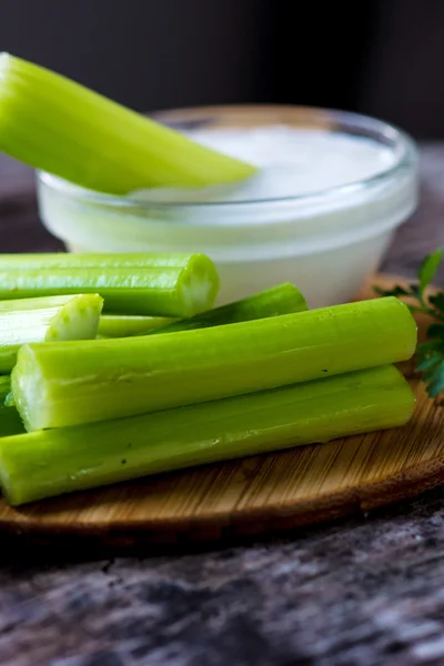 Celery sticks with white sauce — Stock Photo, Image