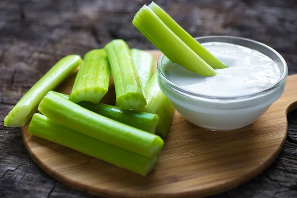 Celery sticks with white sauce — Stock Photo, Image