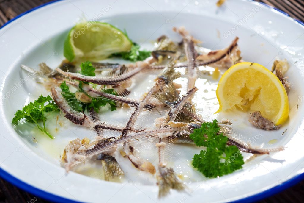 Plate with sardine bones