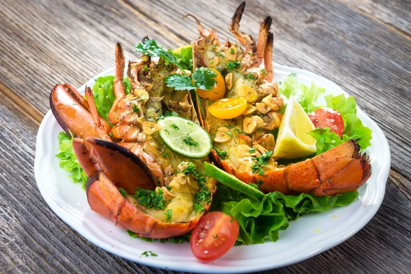 Boiled lobster with vegetables and herbs — Stock Photo, Image