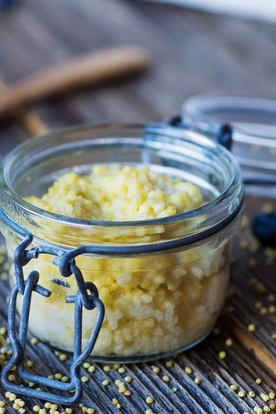 Millet porridg in glass jar — Stock Photo, Image