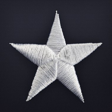 Macro shot of hand stitched gray star from an american flag