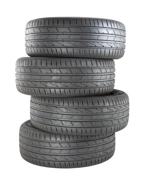 Four New Black Tyres Car Driving Isolated White Background — Stock fotografie