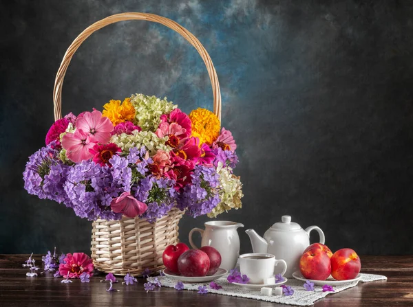 Rustic Still Life Basket Summer Flowers Tea Utensils Peaches Plums — Stock Photo, Image