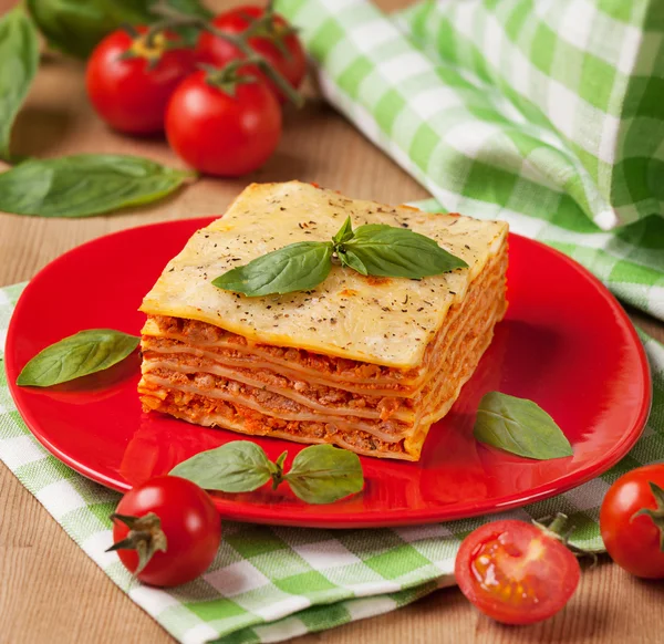 Tasty lasagna with tomatoes — Stock Photo, Image