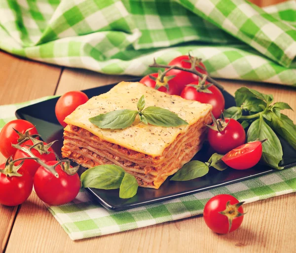 Tasty lasagna with tomatoes — Stock Photo, Image