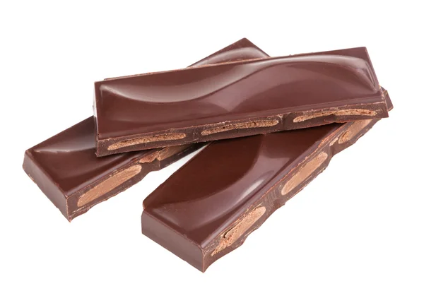Bitar av choklad isolerade — Stockfoto