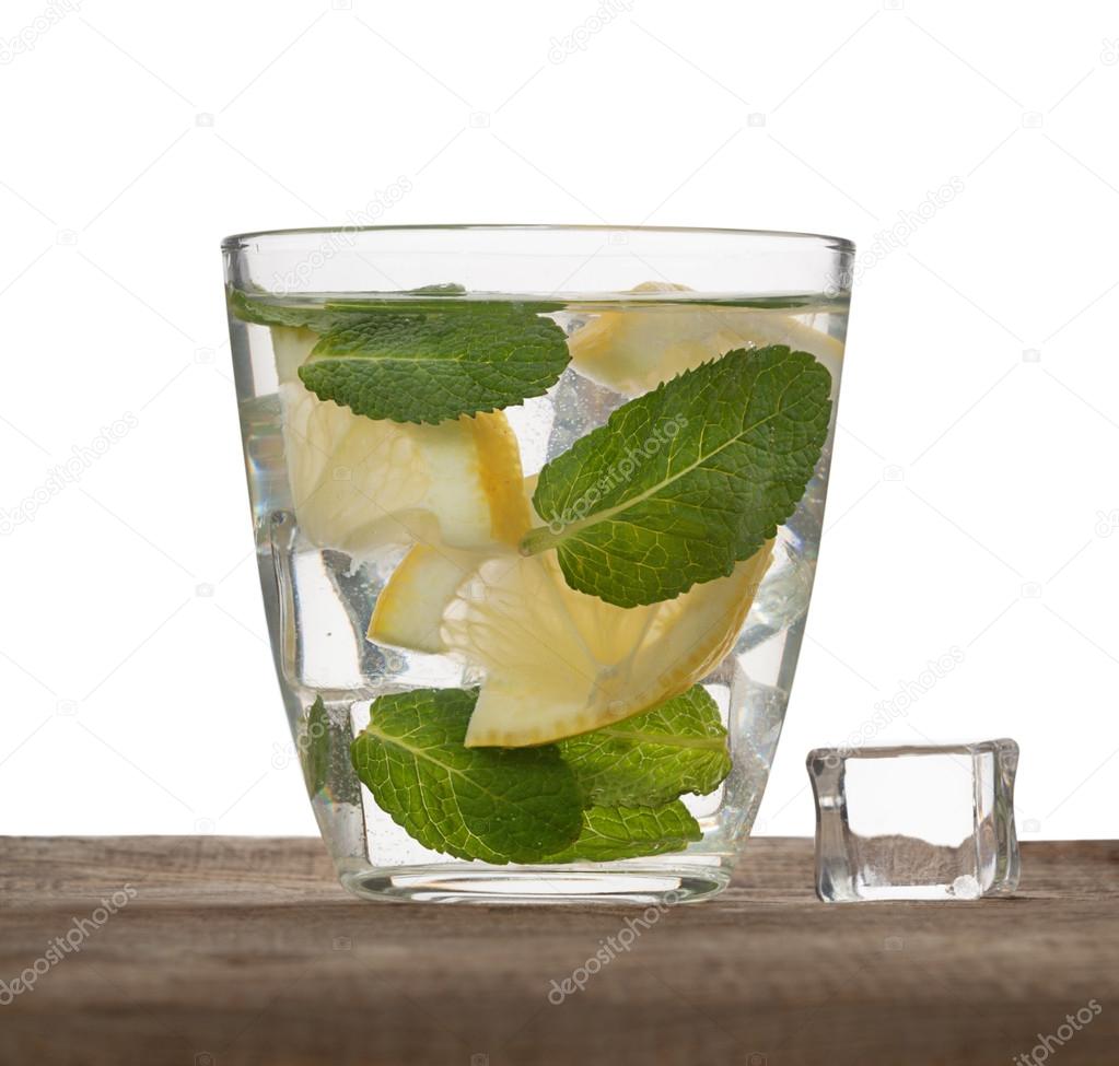 Water, ice, lemon and mint isolated