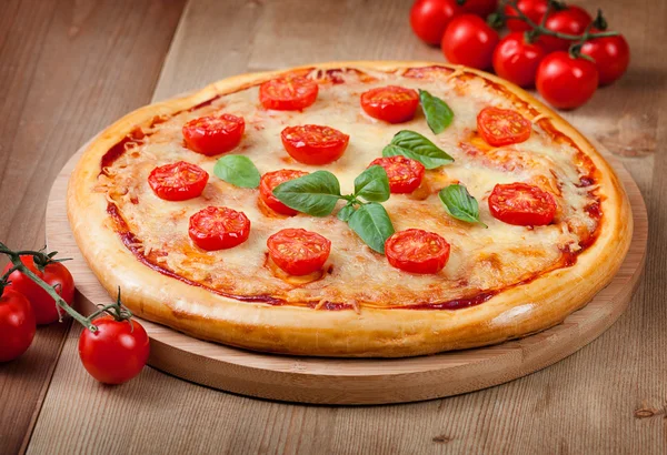 Fresh pizza on wood — Stock Photo, Image