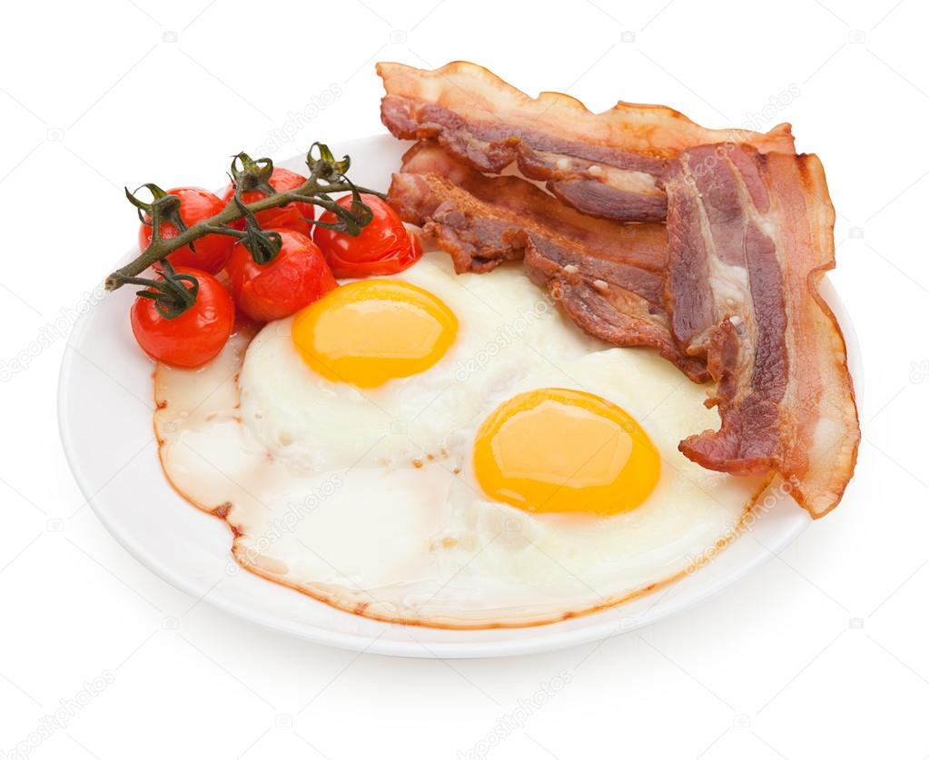 Plate with fried eggs, bacon isolated