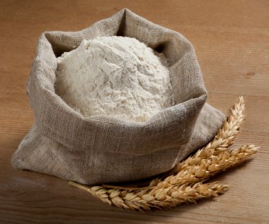 Flour in a bag and spikes on the old board