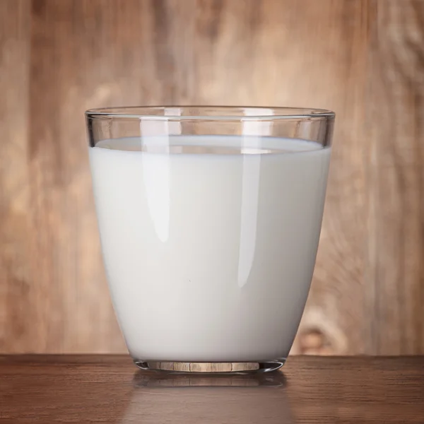 Fresh milk in a glass on the old table — 스톡 사진