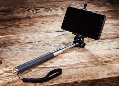 Kendini ve smartphone eski panoları sopa