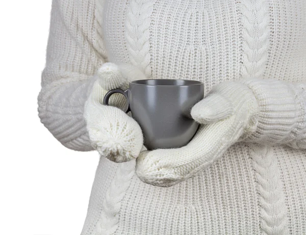 Christmas concept. Coffee cup in female hands dressed in mittens 로열티 프리 스톡 사진