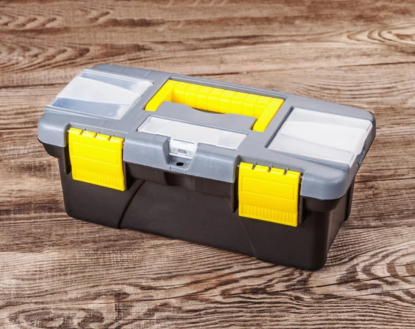 Plastic doos voor tools op het oude bord — Stockfoto