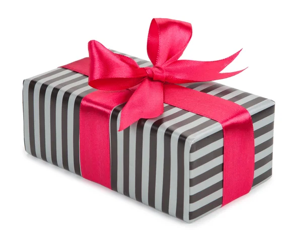 Striped gift box with a bow and ribbon — Stock Photo, Image