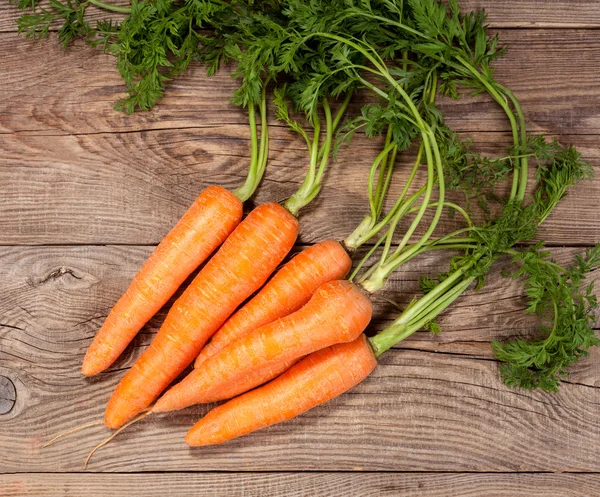 Carrot on the old board. rural concept — Stock Photo, Image