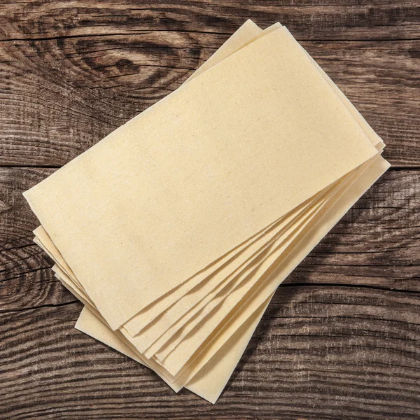 Raw lasagna sheets on the boards — Stock Photo, Image
