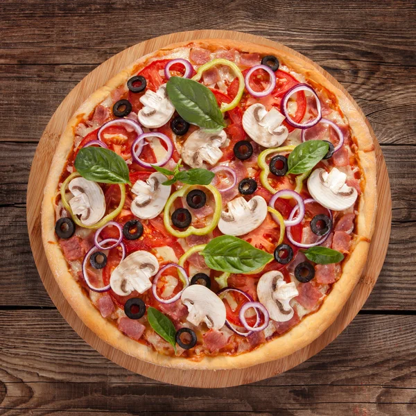 Italian delicious pizza with mushrooms and ham — Stock Photo, Image