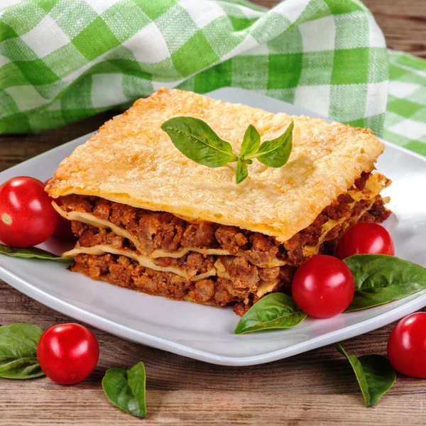 Tasty lasagna on old boards — 图库照片