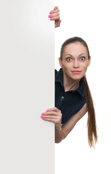 Young woman behind blank white board — Stock Photo, Image