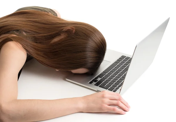 Tired girl sleeping on laptop — Stock Photo, Image