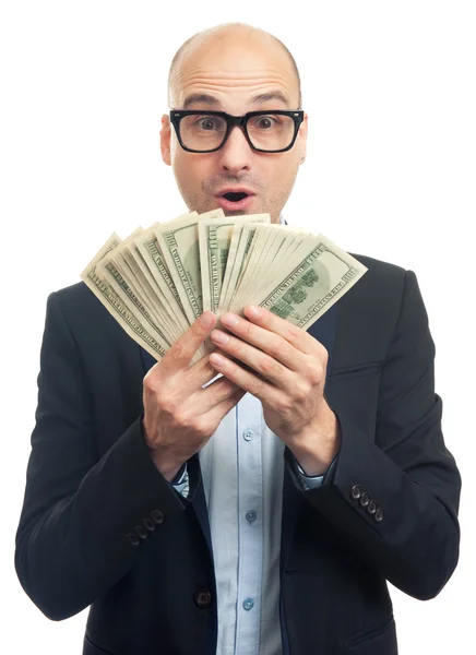 Hombre calvo sorprendido sosteniendo mucho dinero — Foto de Stock