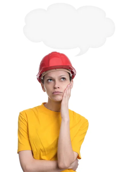 Girl in red hard helmet daydreaming — Stock Photo, Image