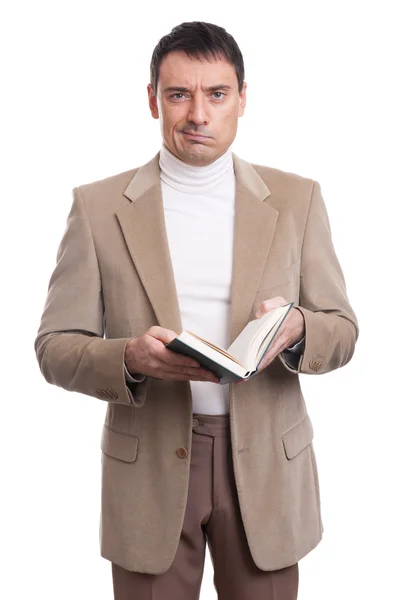 Un hombre serio sosteniendo un libro. Aislado —  Fotos de Stock