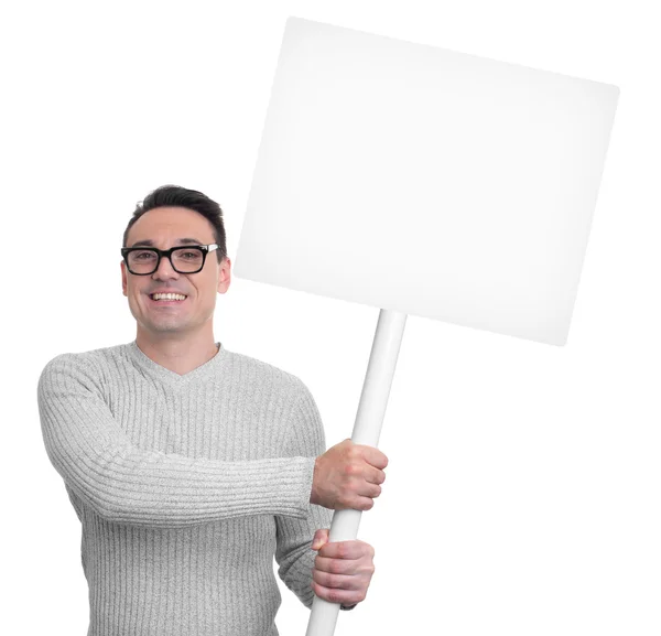 Hombre sonriente guapo sosteniendo pancarta en blanco —  Fotos de Stock
