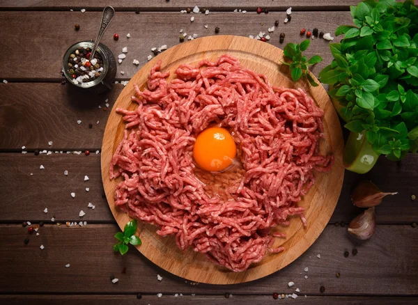 Raw minced meat with egg — Stock Photo, Image