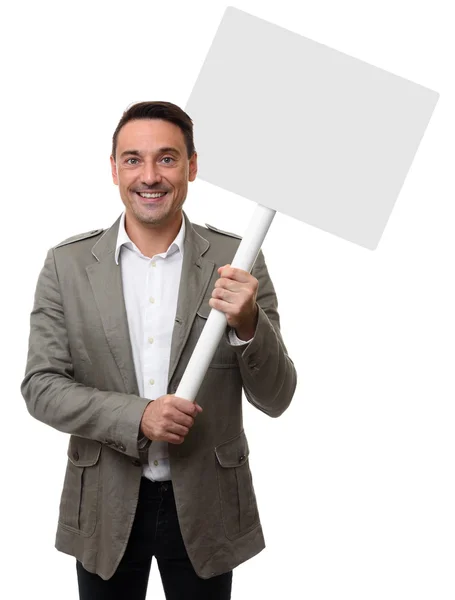 Sorrindo homem segurando um banner em branco — Fotografia de Stock