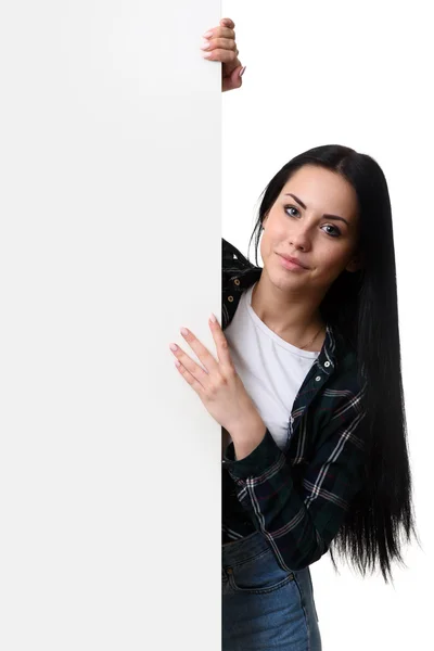 Pretty girl presenting blank white billboard — Stock Photo, Image