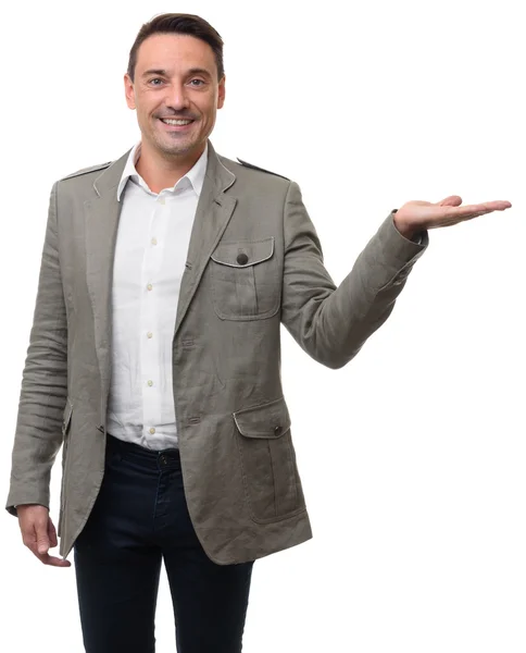 Hombre de negocios sonriente mostrando la palma de la mano abierta — Foto de Stock