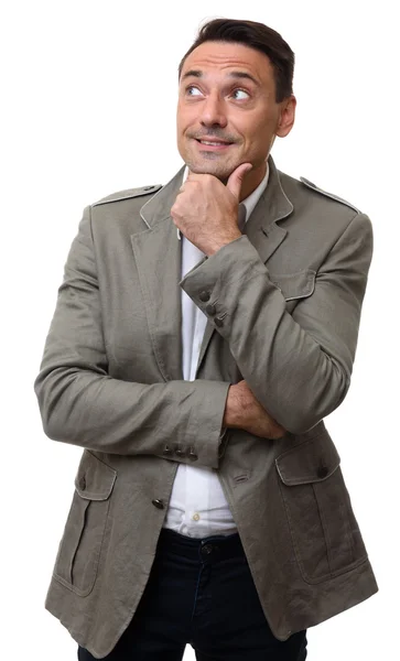 Pohledný muž v módní bunda při pohledu na místa kopie — Stock fotografie