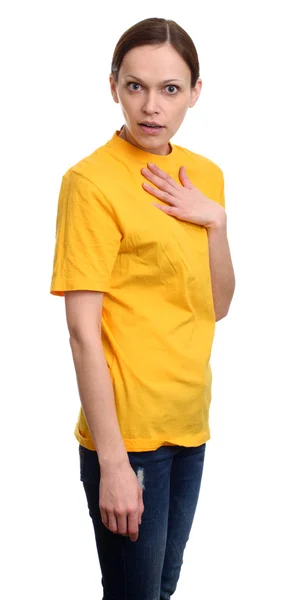 Shocked casual woman in yellow t-shirt — Stock Photo, Image