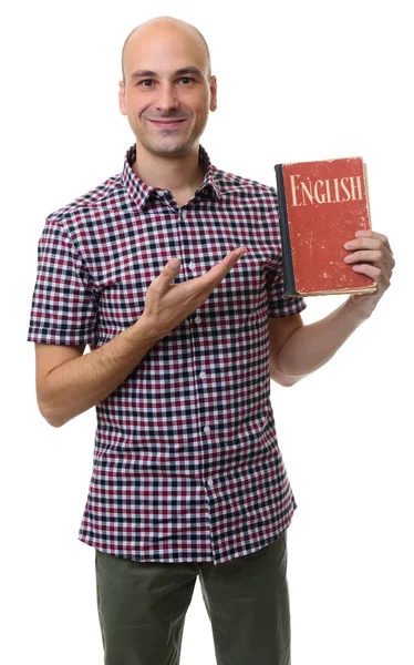 Εκμάθηση της αγγλικής γλώσσας. Χαμογελαστός άνθρωπος κρατά ένα βιβλίο — Φωτογραφία Αρχείου