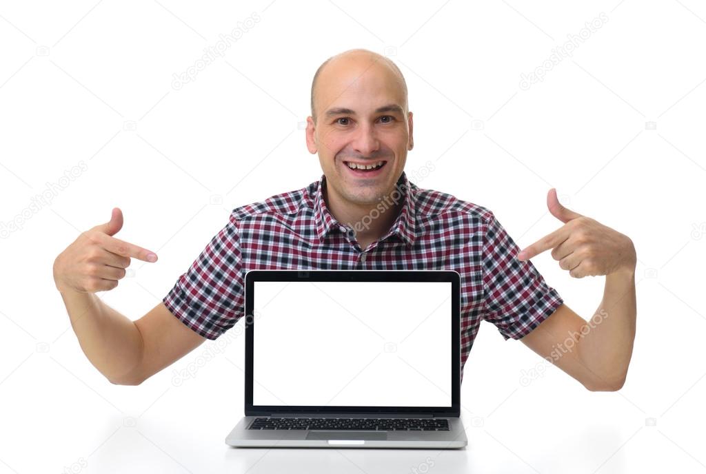 man sitting at desk and pointing on laptop with blank screen