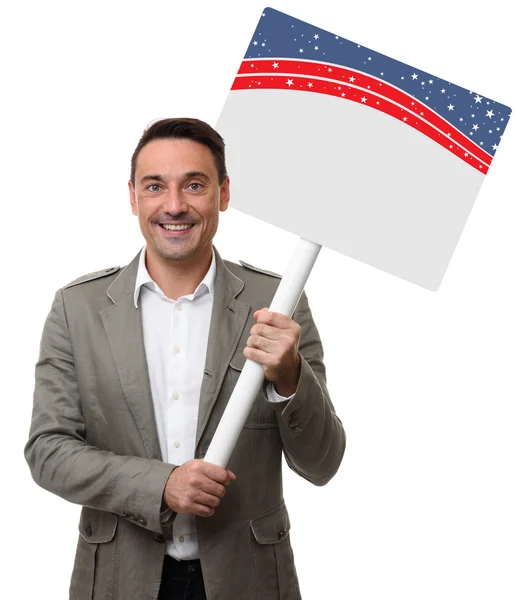 Handsome man holding a blank placard. Isolated — Stock Photo, Image