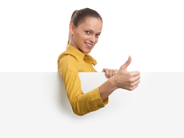 Young smiling woman showing blank card — Stockfoto