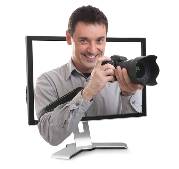 Photographer in the computer monitor Stock Picture